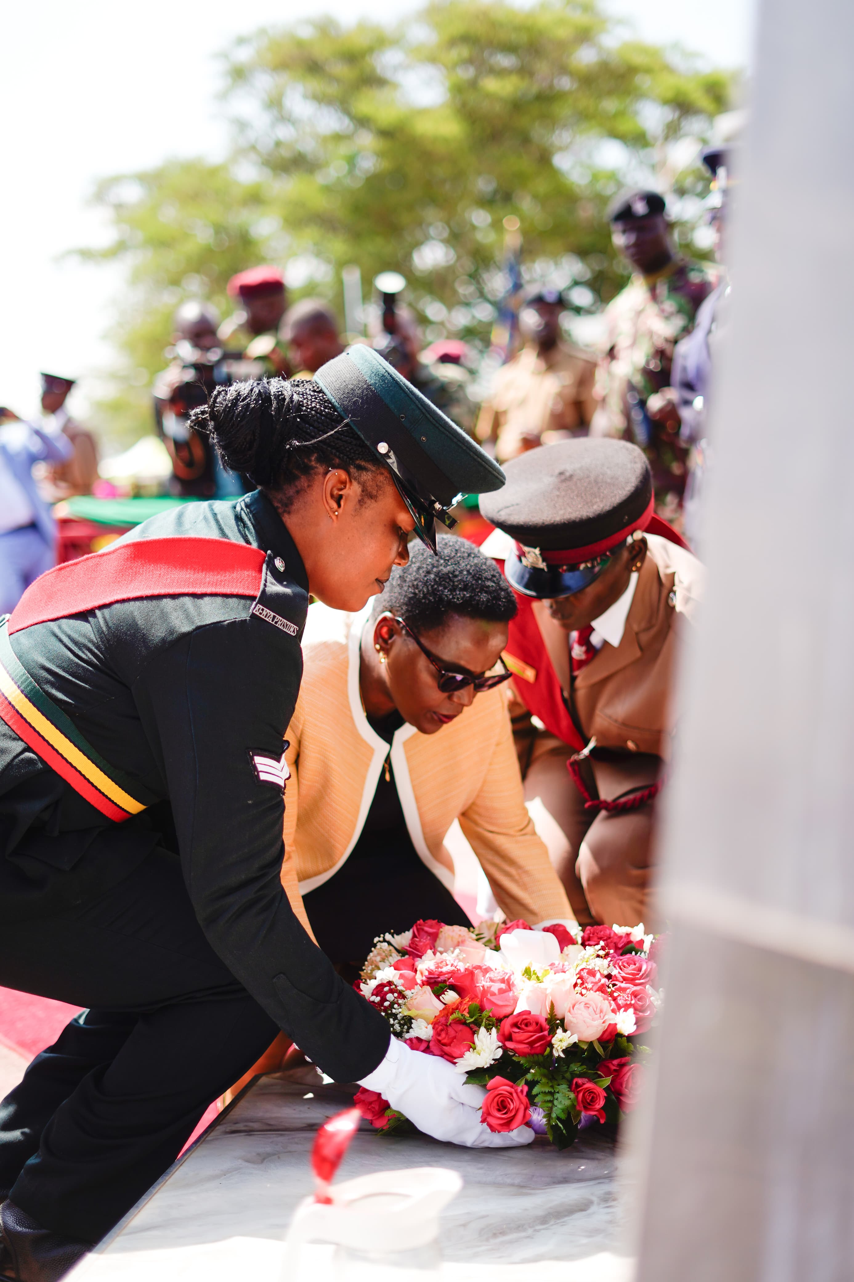 Correctional Services Principal Secretary Dr. Salome Beacco lays a wreath to commemorative fallen national police and Kenya prions service officers.