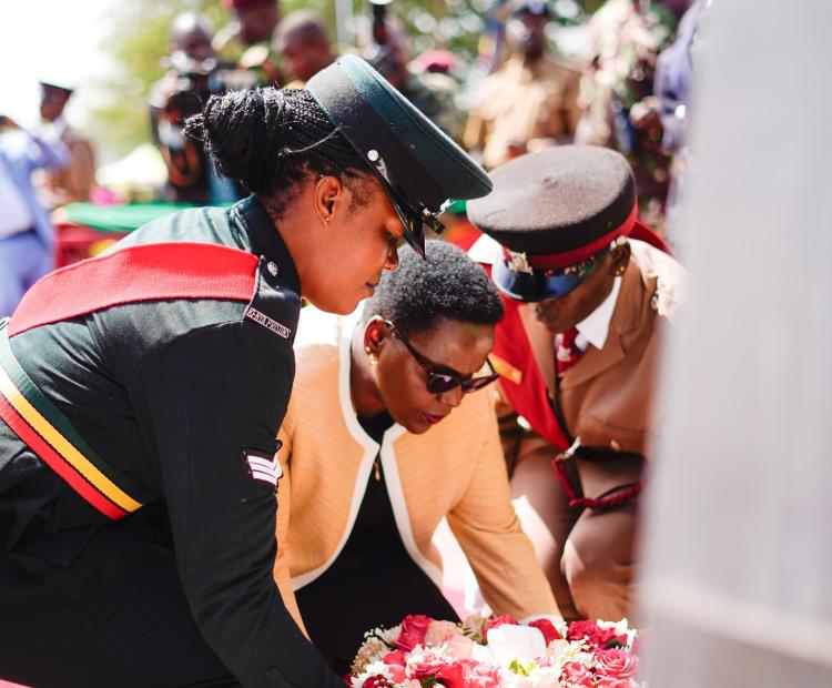 Correctional Services Principal Secretary Dr. Salome Beacco lays a wreath to commemorative fallen national police and Kenya prions service officers.